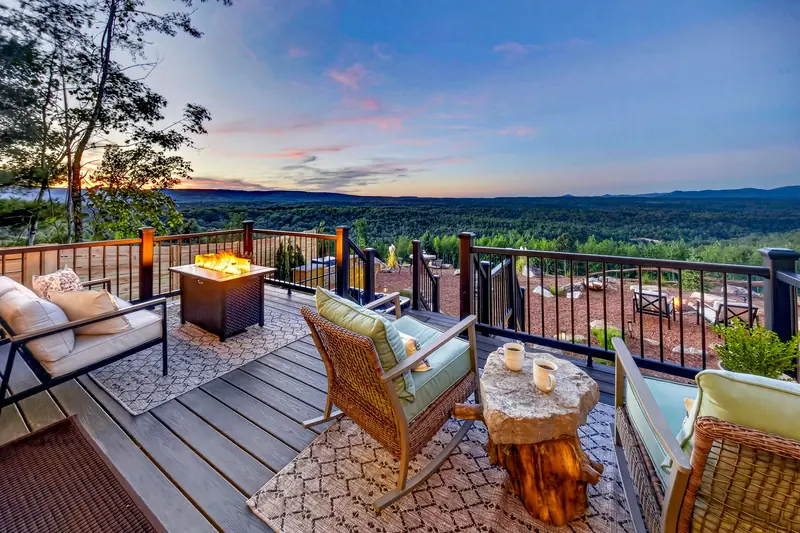 The deck at sunset with the fire table lit