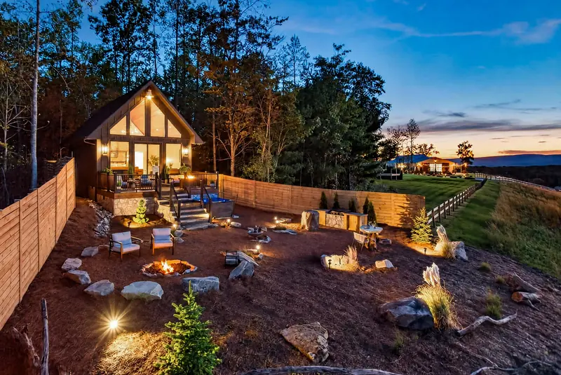 The cabin and landscape lighting at twilight