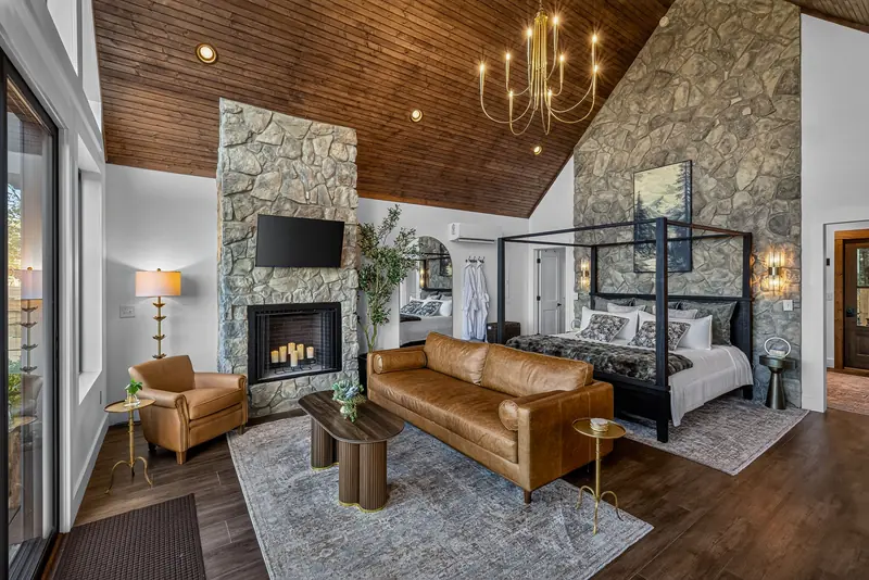Fireplace, lounge and canopy bed together in the open great room