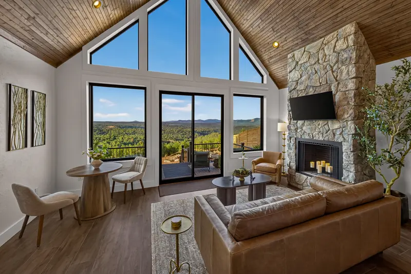 A bistro table for two beside the A-frame windows
