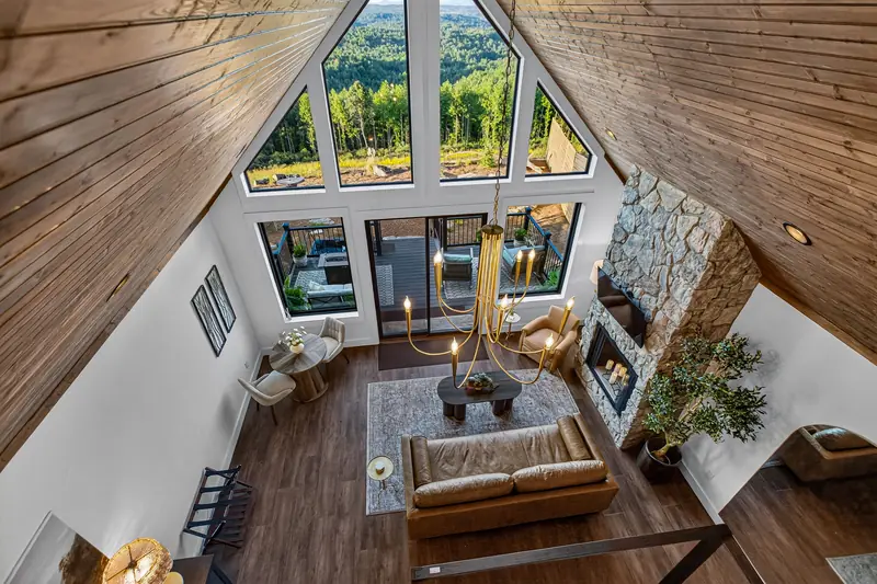 Looking down on the great room toward the wall of windows
