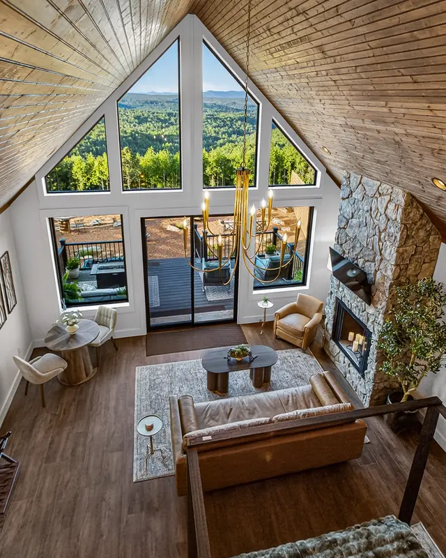 The great room from above, framed by the A-frame glass