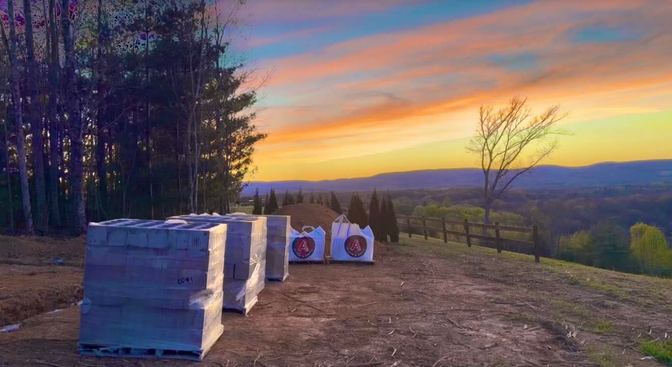 Building materials on the mountaintop at sunset with panoramic mountain views